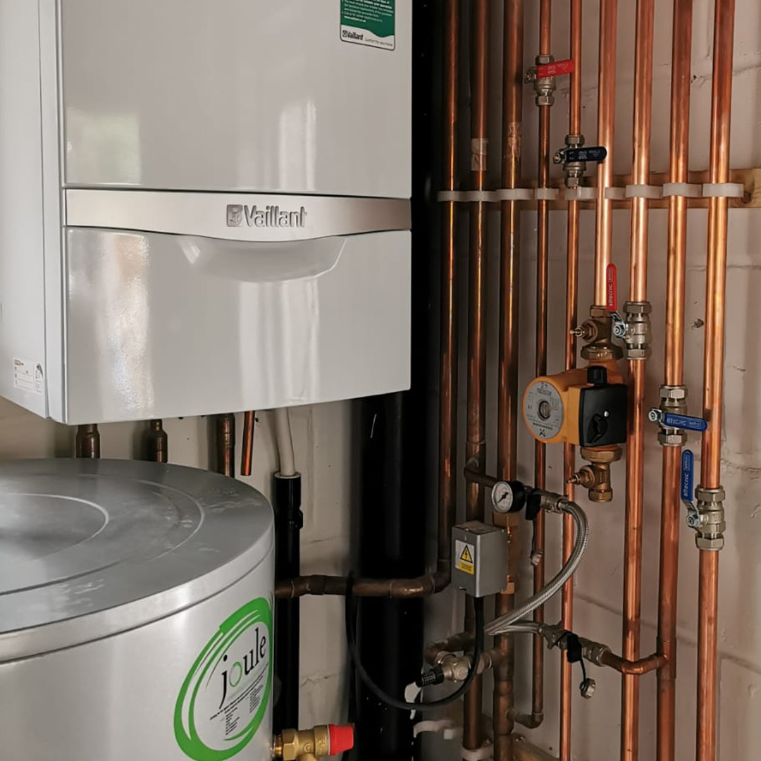 A Vaillant boiler and unvented cylinder installed by J Dunne Plumbing & Heating, with neat copper pipework